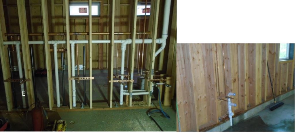 Plumbing infrastructure install continues View of plumbing infrastructure in place between framed walls