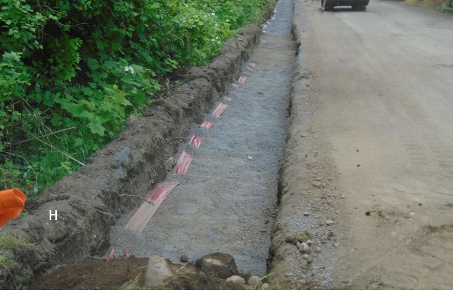 Main trench entering the site now back filled and holding fiber optic cable and electricity service lines