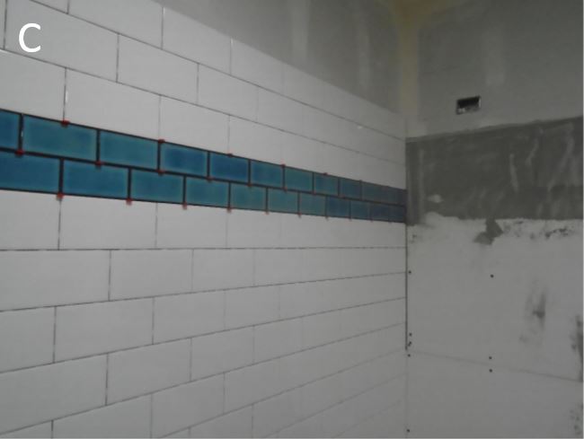 Wall of tile installed in restroom