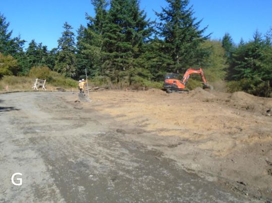 Workers finishing cul-de-sac at old entry road