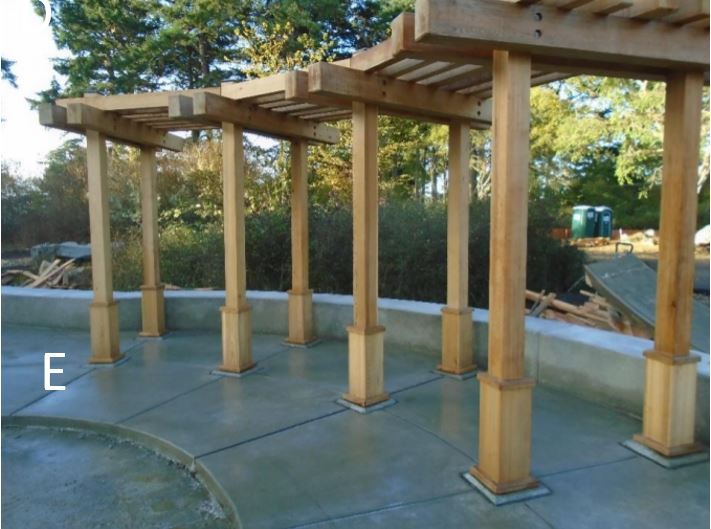 Interpretive trellis and knee wall Combined view of interpretive trellis with knee wall in background