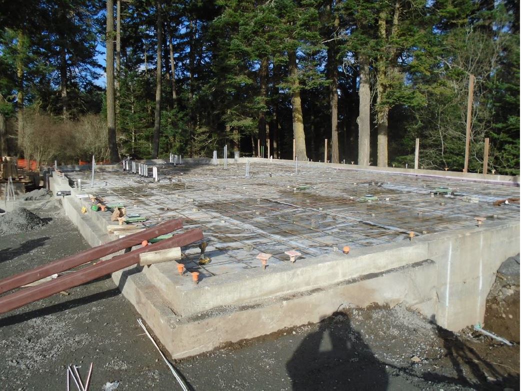 A wide shot view of the entire building foundation with the rebar complete for the next day’s concrete pour