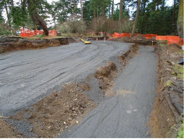 Compacted sub-base aggregate fills out the newly excavated area where the visitor center will built