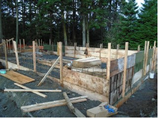 A temporary wood frame is constructed to the leveled height around reinforcing steel for another cement pour