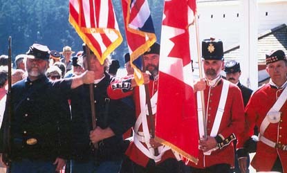 The precursor of Battery D Foundation color guard marches from during the first Encampment in 1998.