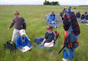 Fifth graders from Fruiay Harbor Elementary take reading from Mt. Finalyason's prairie lands as part of the park's habitats education program.