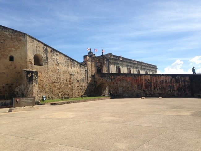 Open plaza with sandstone masonry walls