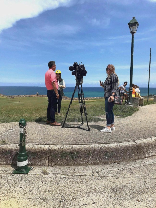 Reporter making a interview at the San Felipe del Morro Esplanade