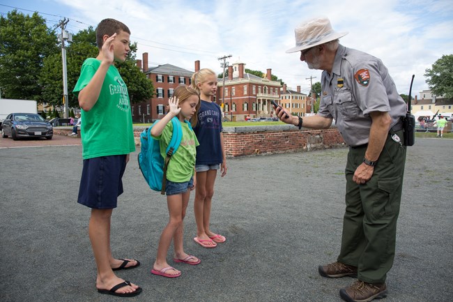 Young visitors take the junior ranger oath.