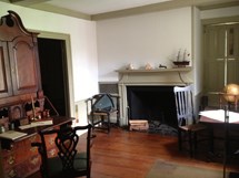 a desk and table are the basic furnishings of a counting house