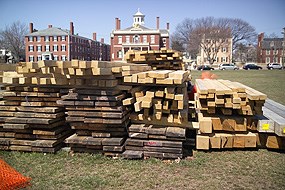 Stacks of lumber sitting on Derby Wharf.