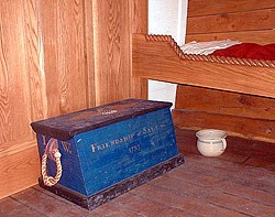 the captain's cabin is just big enough to hold a bed and the captains sea chest.