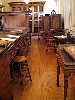 the business office in the Custom House contains long counters and plenty of drawers for the storage of documents the business office in the Custom House contains long counters and plenty of drawers for the storage of documents