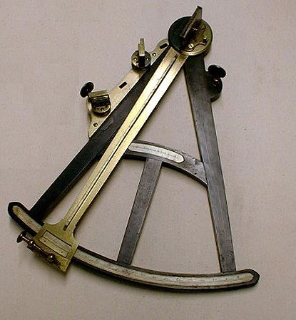 a late 18th century quadrant, made of ebony, brass, and ivory. a late 18th century quadrant, made of ebony, brass, and ivory.