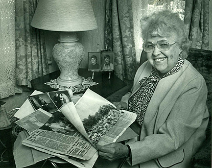 Portrait of a woman with photo albums Portrait of a woman with photo albums