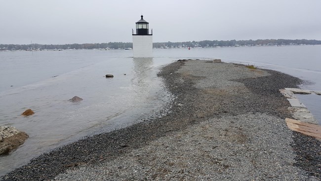 A historic wharf has been partially flooded from high water.