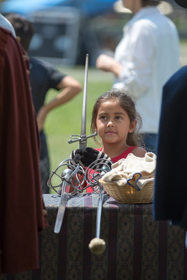 irl holds 17th century style sword