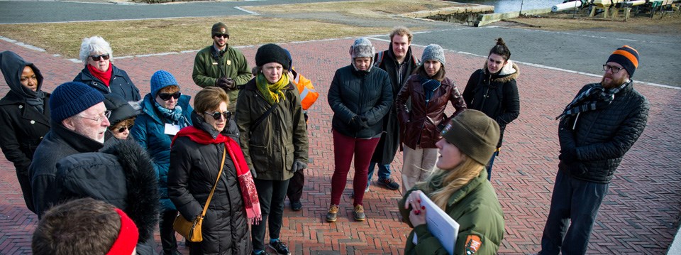 Ranger leading a tour outside