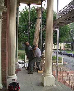 Salem Maritime staff removing a column from the Salem Custom House portico for repair.
