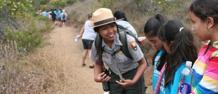 Ranger Anela talks with students about the Santa Monica Mountains on a ranger-led hike.