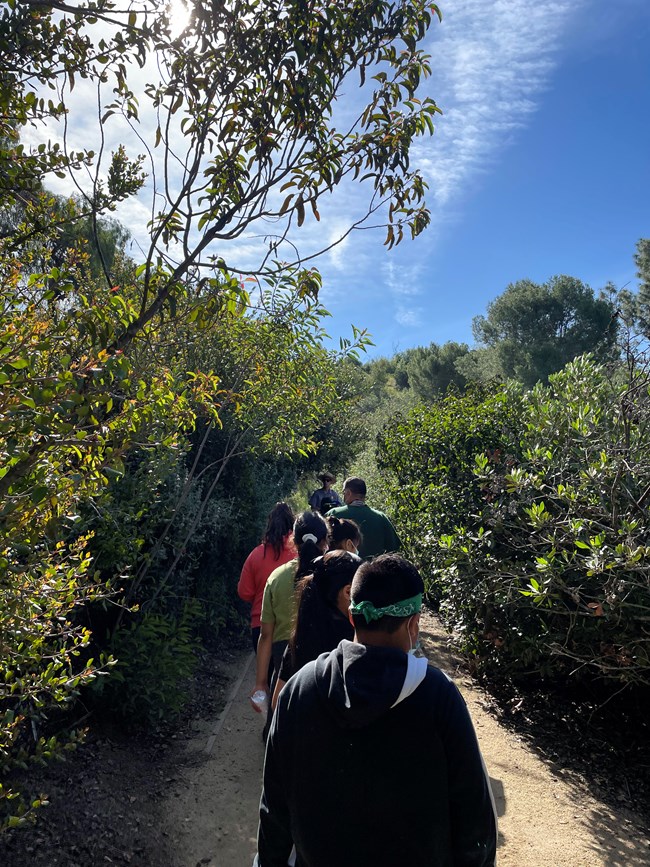 Students follow rangers along the butterfly trail.