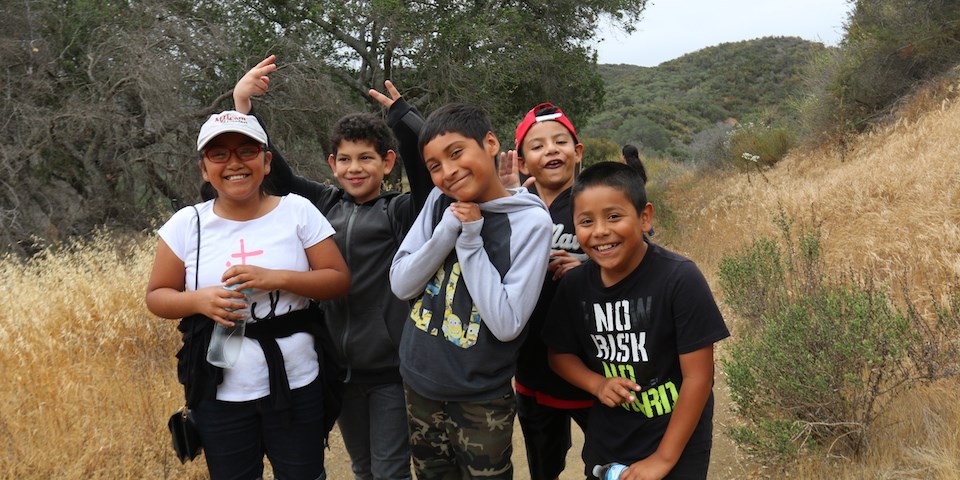 Students pose for a picture while on a hike