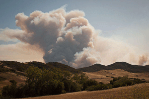 A plume of smoke from the 2013 Spring Fire billows over Rancho Sierra Vista in the Santa Monica Mountains.