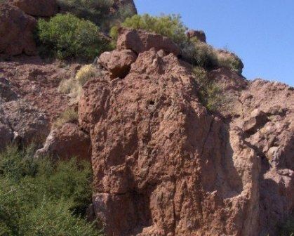 Iron-rich volcanic rock is easily seen on the Sandstone Peak Trail. You can even feel the fine grain texture of the rock.