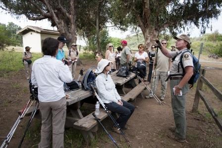 BBT hikers listen to a park volunteer talk about Trippet Ranch.