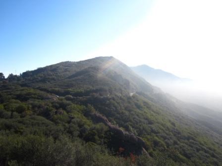 Foggy mountains peaks are nearby in this view from Mishe Mokwa Trailhead