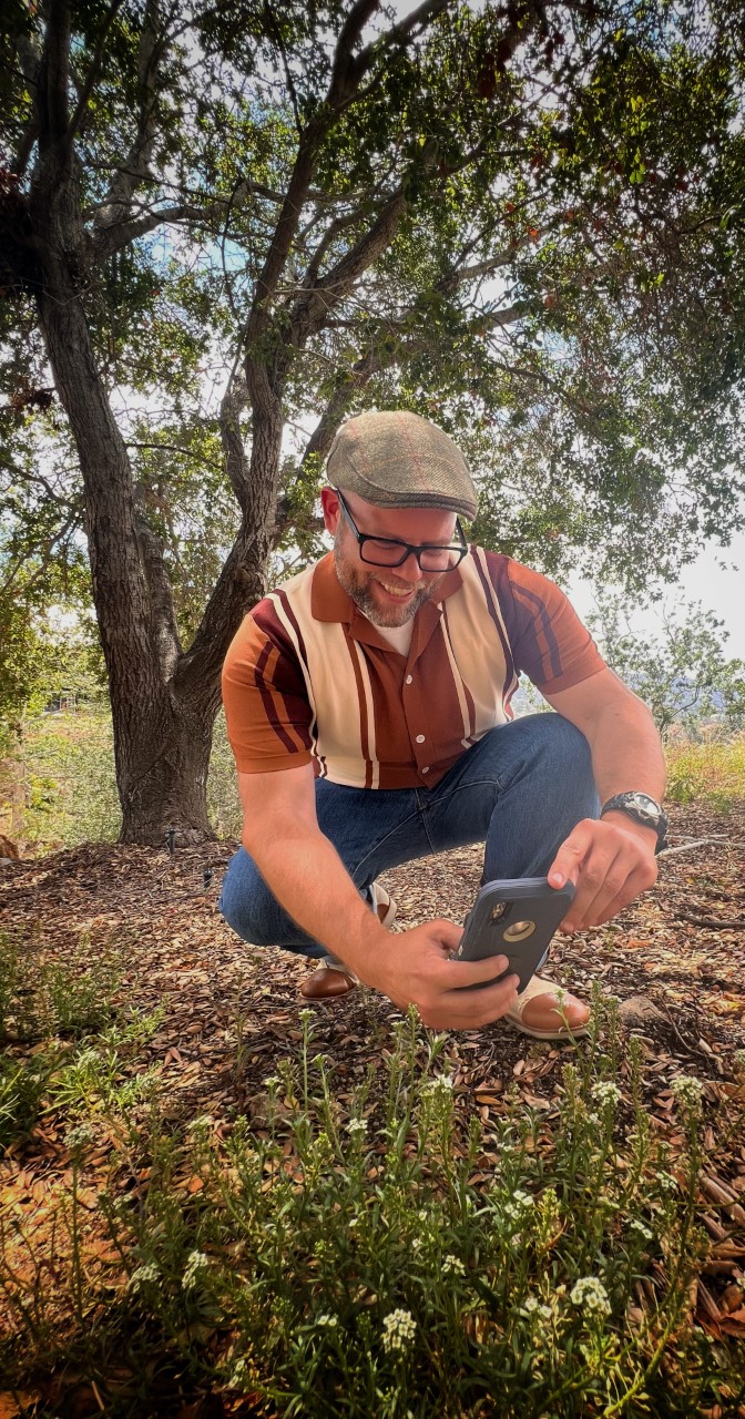 Park visitor taking photos of wildflowers Park visitor taking photos of wildflowers