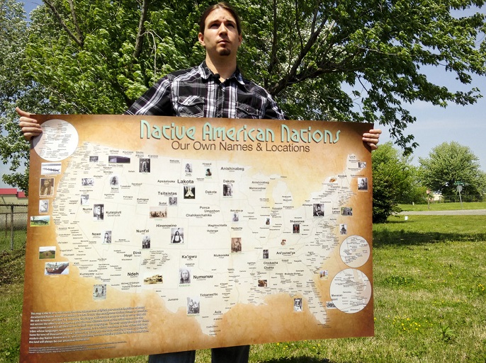Aaron Carapella holding his map of the continental United States.
