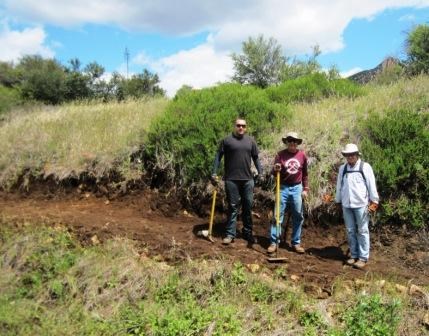 Santa Monica Mountain Trails Council volunteers take a break from working on the trail to pose for a picture.