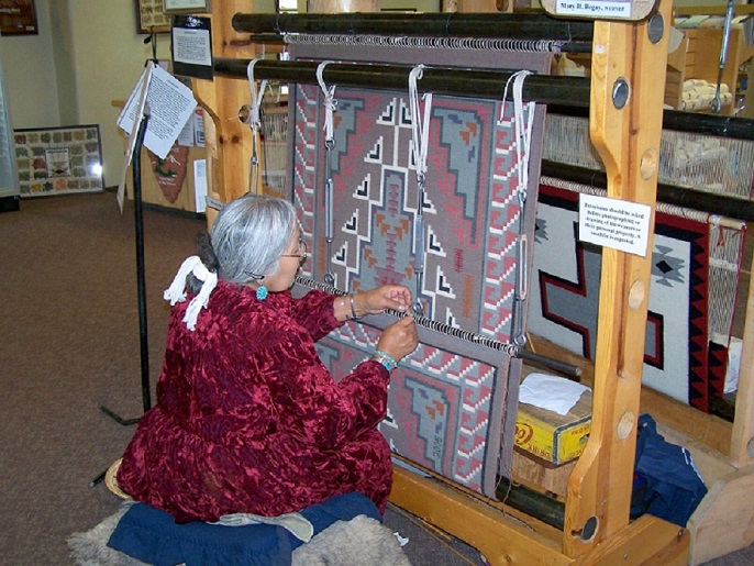 Rug weaver weaving a rug