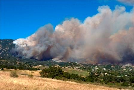 This fire is driven by steep topography, dry vegetation, and fast winds.