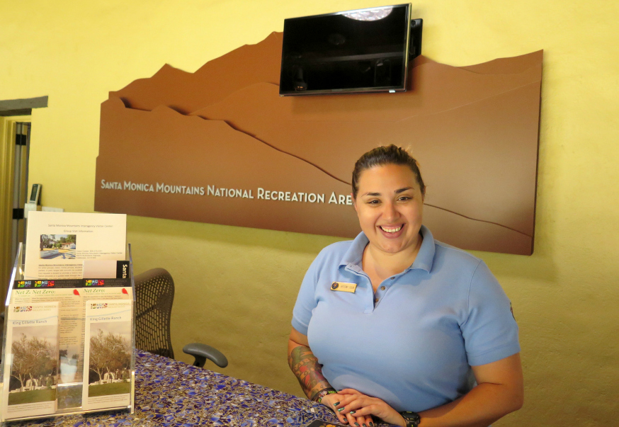 A volunteer staffs the Visitor Center