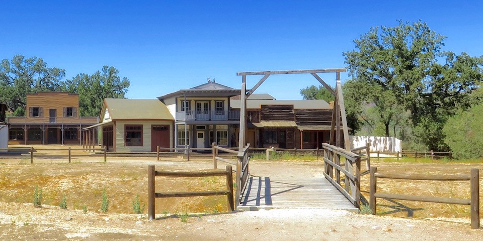 A wooden bridge welcomes you into an old western town