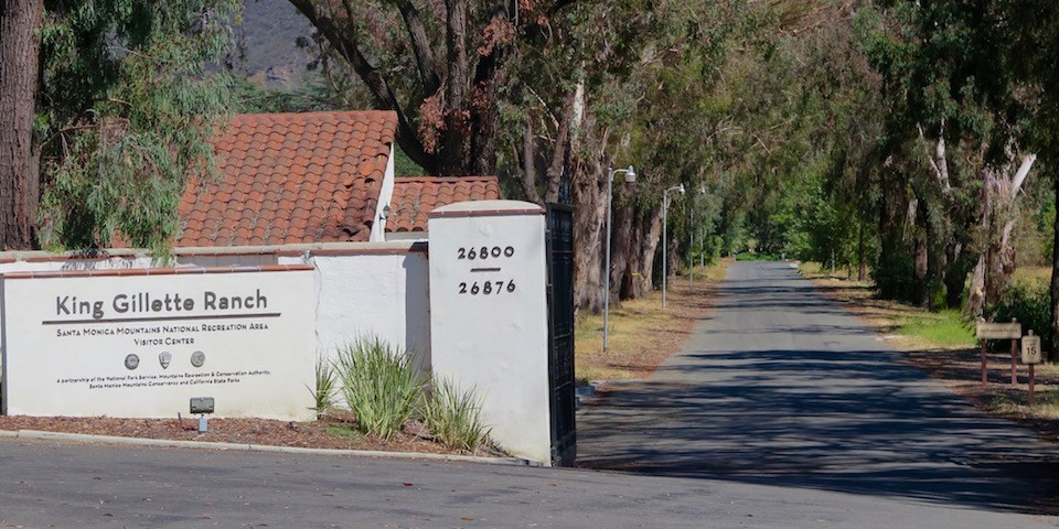 The street leading to the visitor center is to the right of the King Gillette Ranch sign