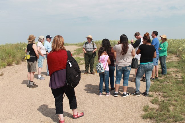 Park ranger conducting guided tour for park visitors