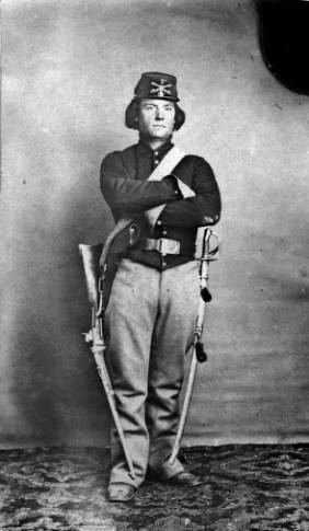 Private Joseph Aldrich of the First Colorado Cavalry died at the Sand Creek Massacre. He is seen here in uniform with carbine and saber. Private Joseph Aldrich of the First Colorado Cavalry died at the Sand Creek Massacre. He is seen here in uniform with carbine and saber.