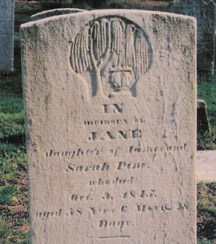 This gravestone contains images of the classical revival of the early 1880s.