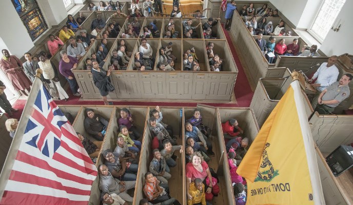 Students from Rebecca Turner Elementary and Benjamin Turner Middle Schools in Mount Vernon celebrate the renaming of their schools at St. Paul's Church National Historic Site.