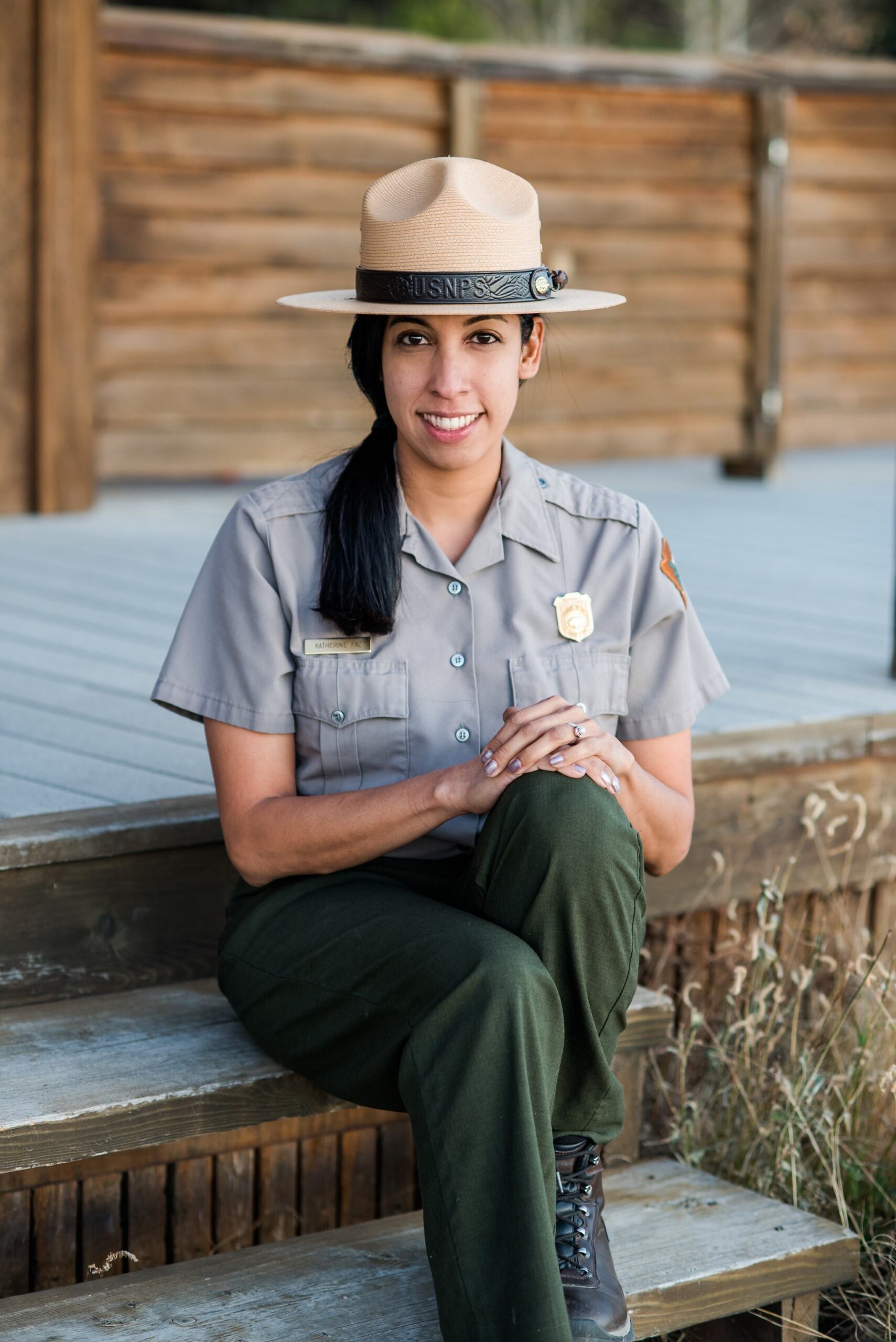 Kathy Faz Garcia Portrait A female posing in a seated position and smiling.