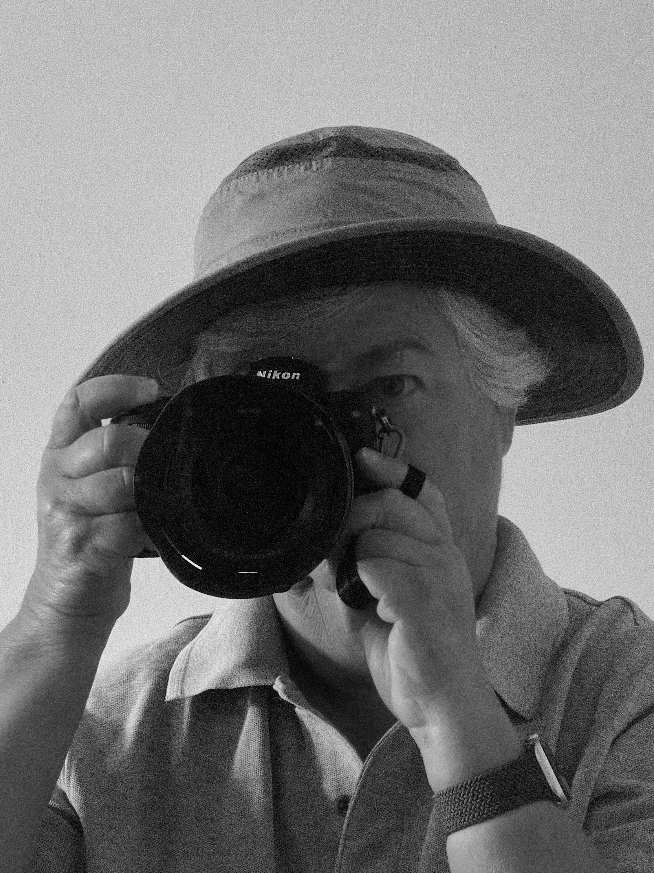 self portrait a black and white photo of a woman taking a photo of herself