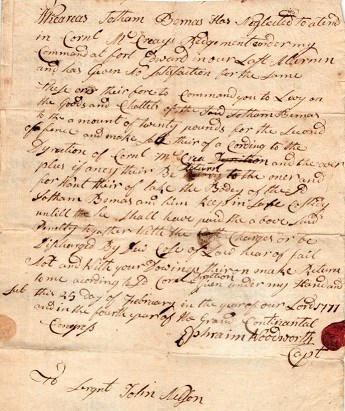 Detail image of a letter, handwritten on paper browned by age.
