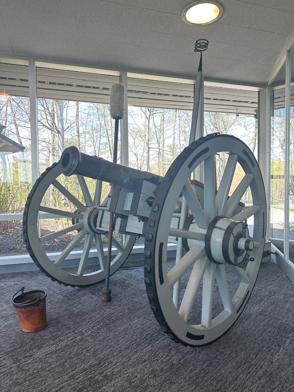 Canon Small bronze cannon mounted on gray carriage