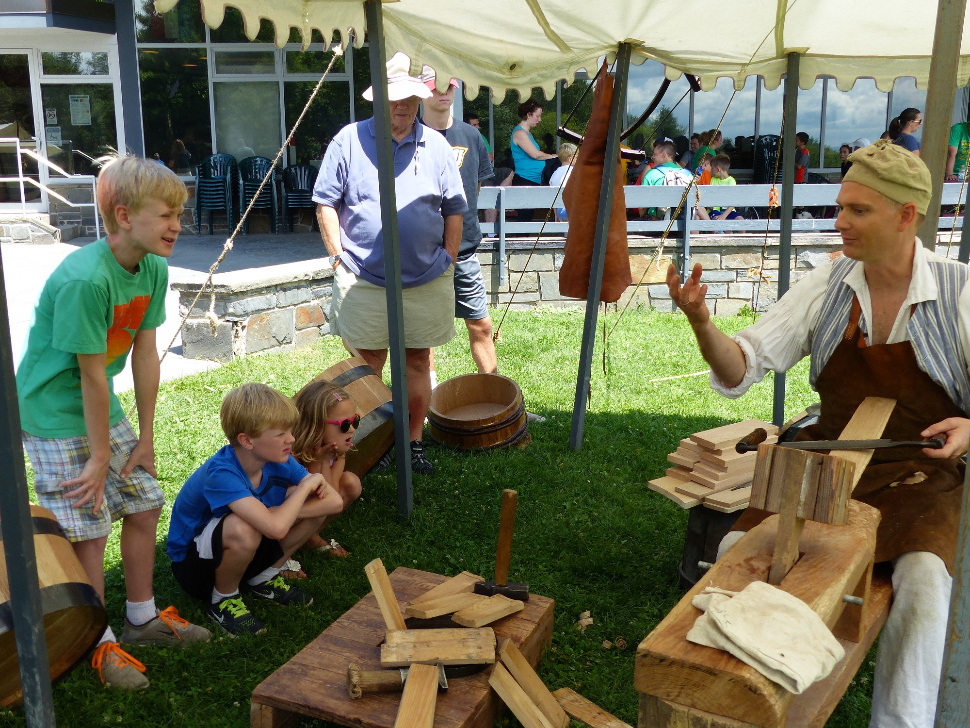 SARA_2107ArmyTrade_cooperkids A barrel maker interacts with visitors at Saratoga NHP Army Trades Weekend