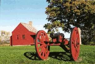 John Neilson Farmhouse, only standing building on the battlefield from the time of the Battles of Saratoga. Small red farmhouse in background, with a cannon on a red carriage in the foreground. John Neilson Farmhouse, only standing building on the battlefield from the time of the Battles of Saratoga. Small red farmhouse in background, with a cannon on a red carriage in the foreground.