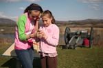 Two young visitors listen to their MP3 player as part of their battlefield tour experience