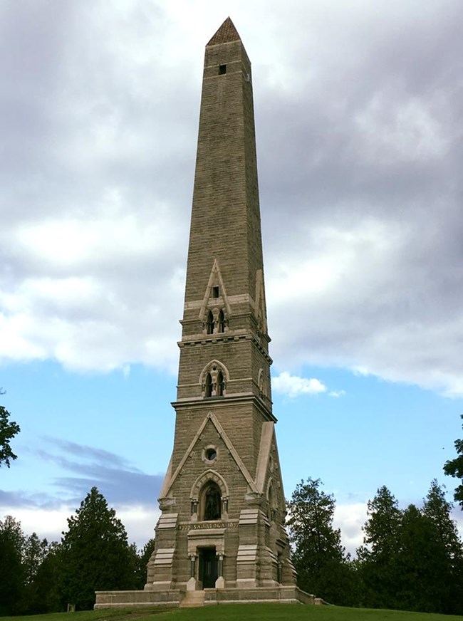 Saratoga Monument Obelisk stands atop a hill